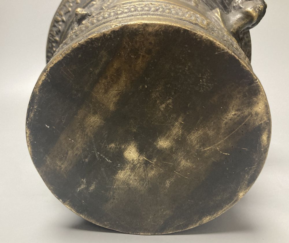 A large bronze mortar and pestle, bearing mock date 1630, 25cm diameter, and two iron and brass canon models